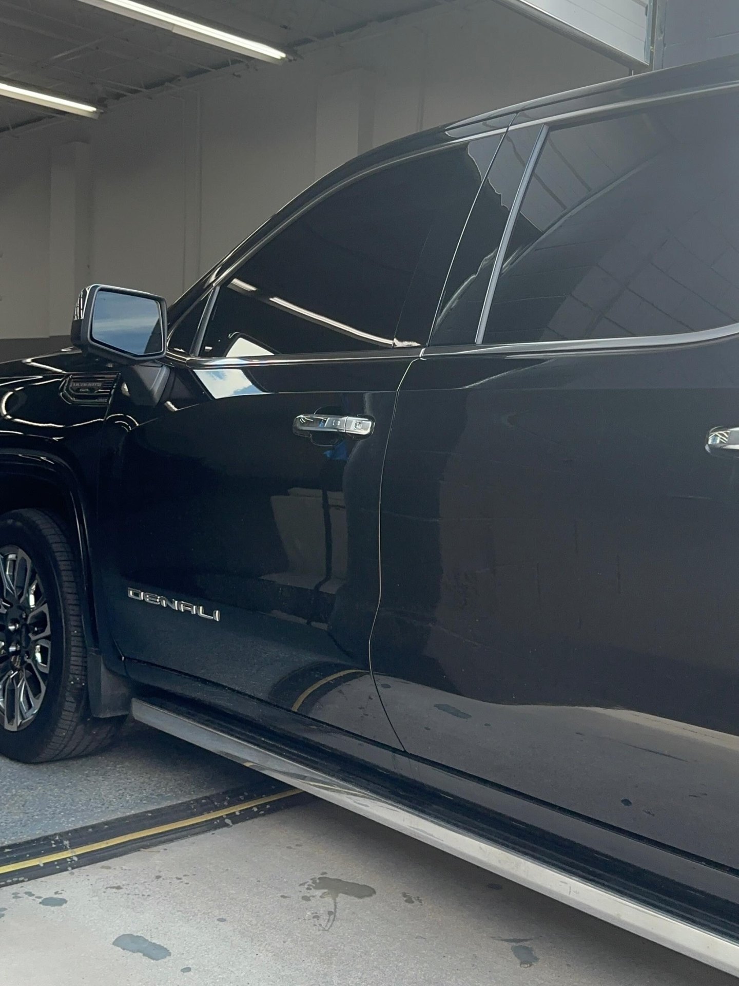 Black GMC Denali with freshly tinted windows in the Lifetime Tint shop