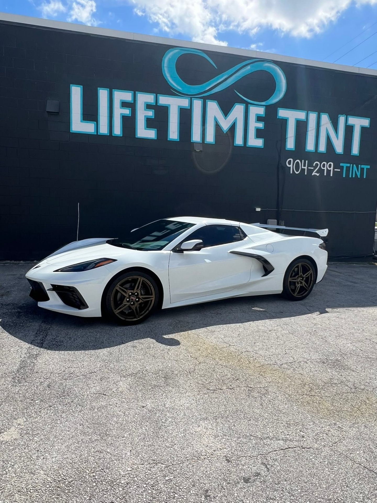 C8 Corvette parked in front of the Lifetime Tint shop on Atlantic Blvd, Jacksonville
